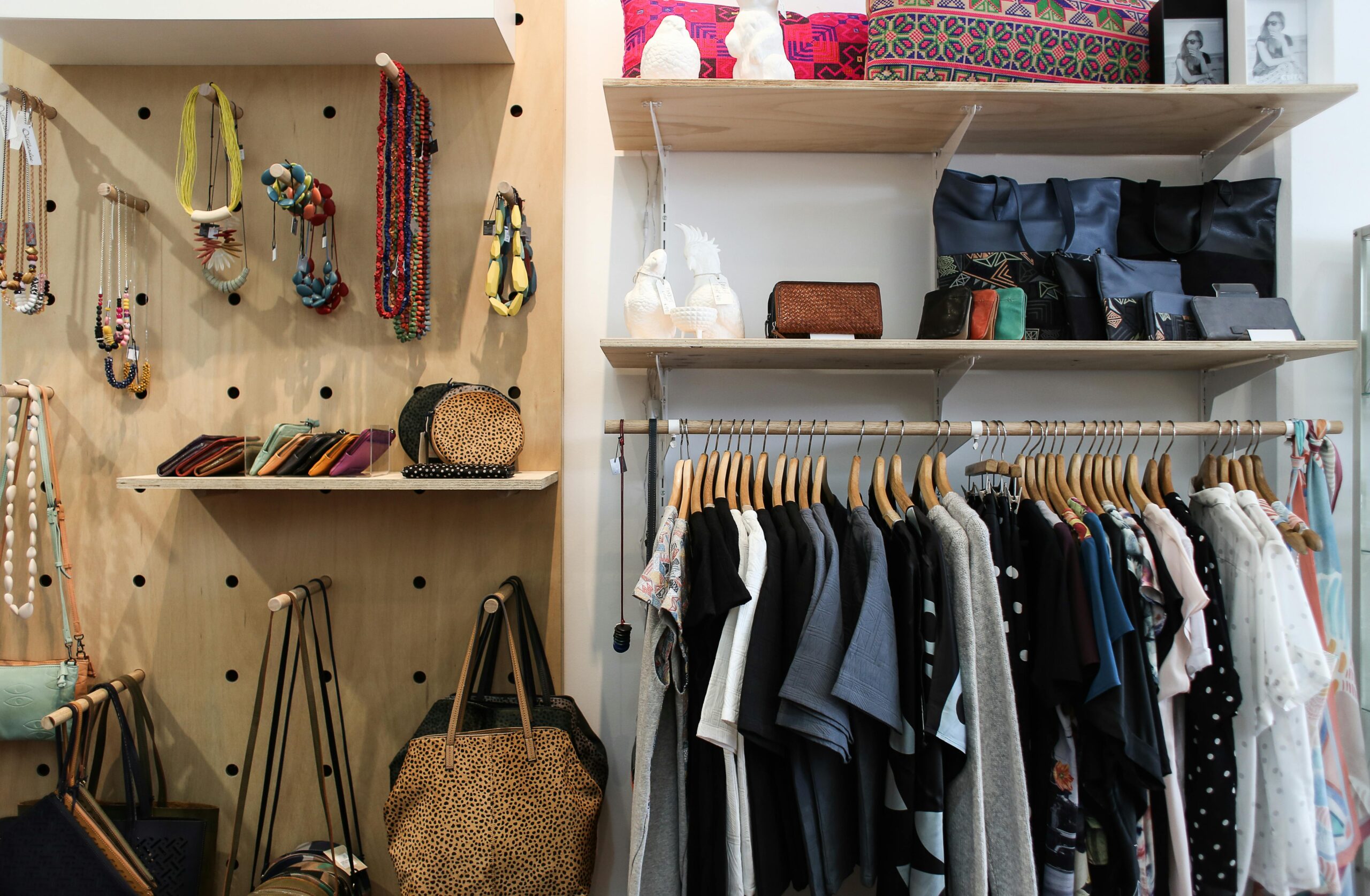 pexels-photo-5864264-5864264 Neatly arranged clothing and accessories in a stylish wardrobe setup.